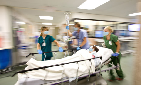 Hospital team rushing patient on gurney