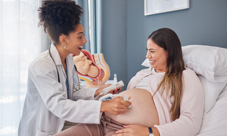 Doctor performing prenatal ultrasound exam